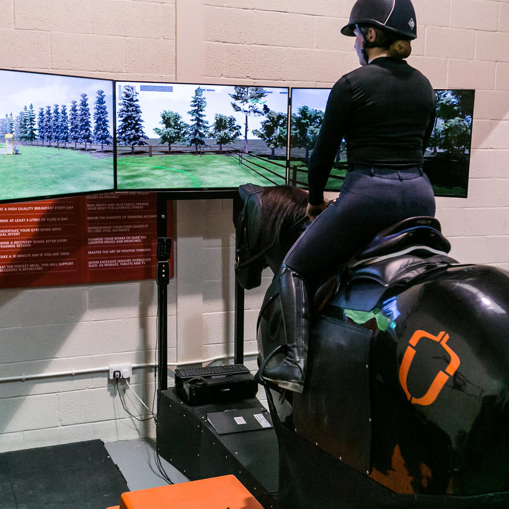 Rider Using Horse Simulator