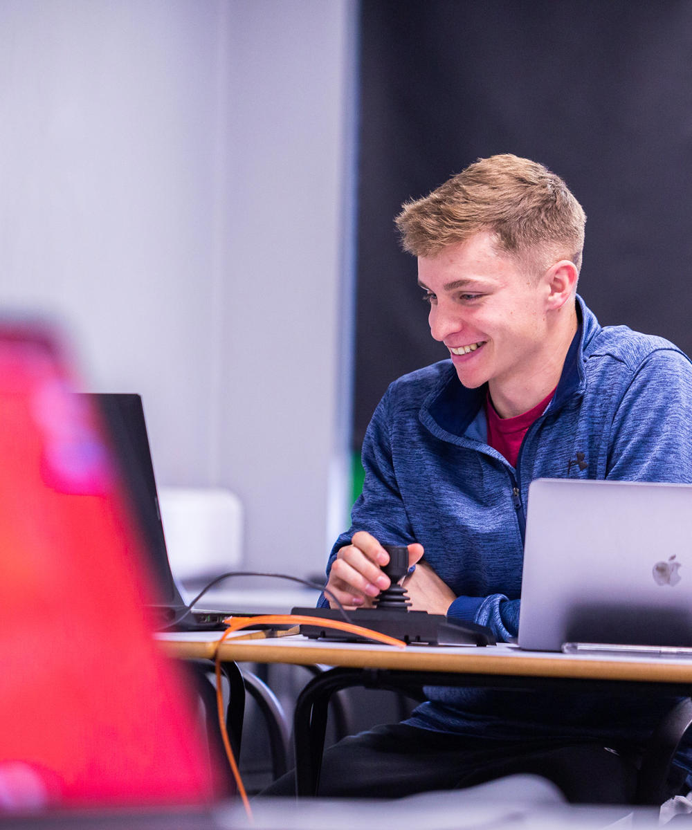 Sport Student Working On Laptop