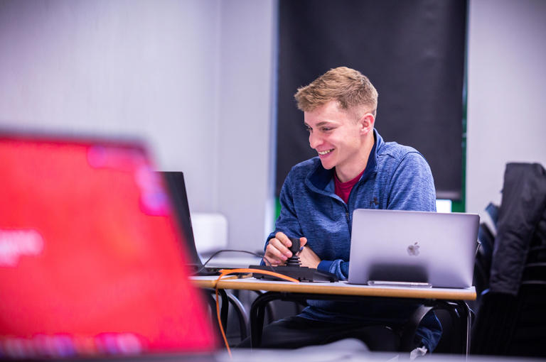 Sport Student Working On Laptop