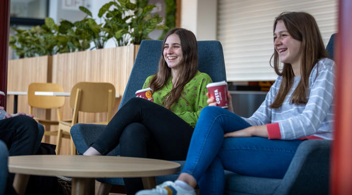 Two students sat enjoying coffee in Graze