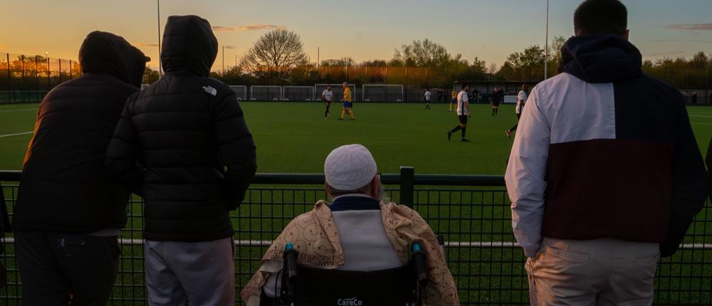 Four Men Watching Sport At Hartpury