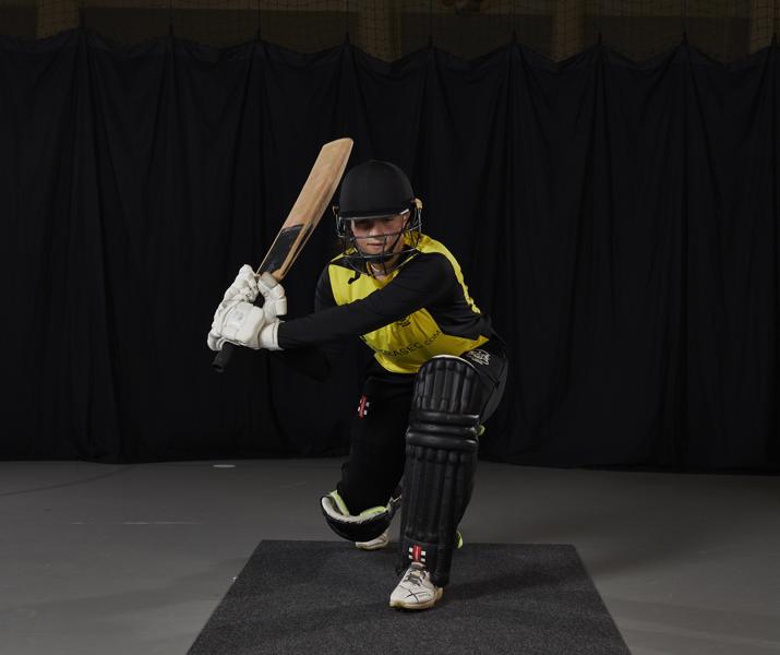 Player Kneeling Down With Cricket Bat1
