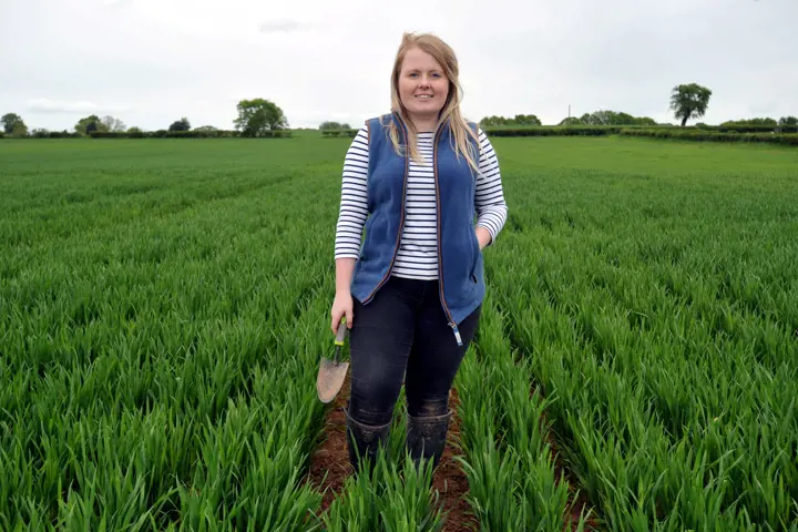 Holly Metcalfe BSc Agriculture graduate stood in field