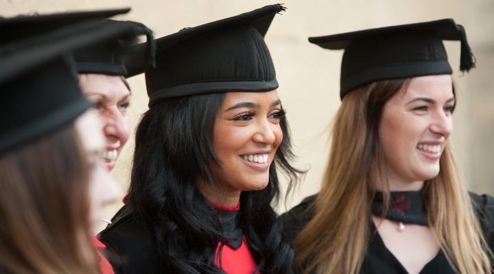 Three University Students At Graduation