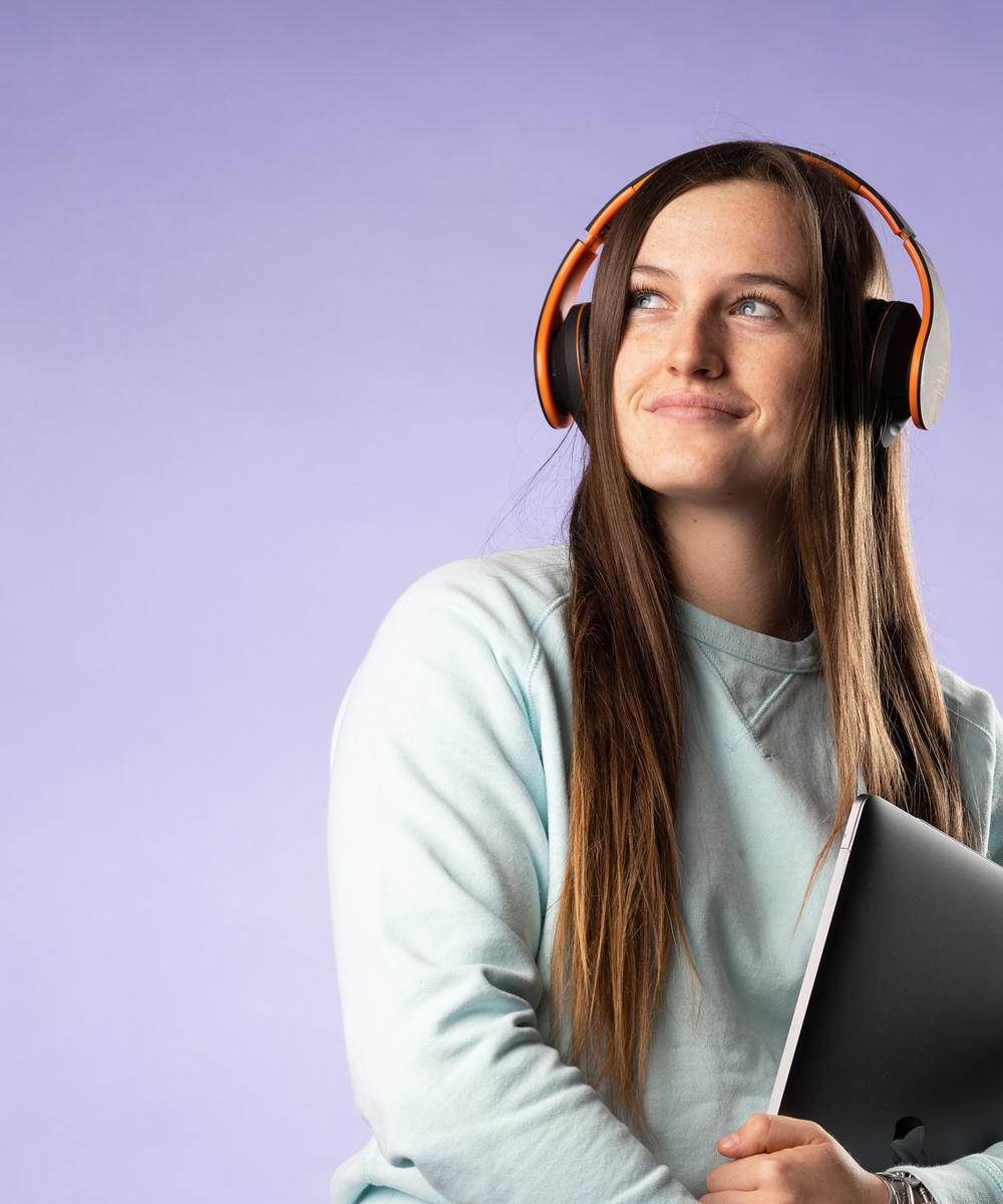 Student Wiht Headphones And Notebook