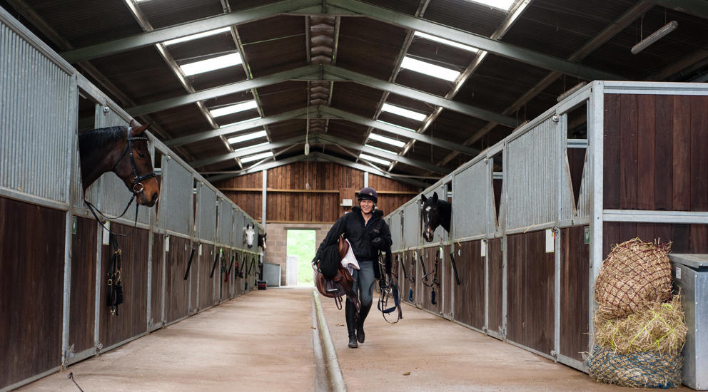 Student Walking Through Equine Yard