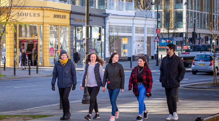 Students Walking Along Street In Cheltenham