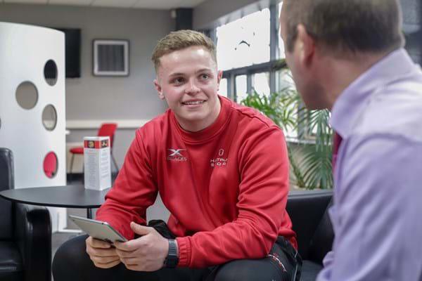 Sport-Student-In-Conversation