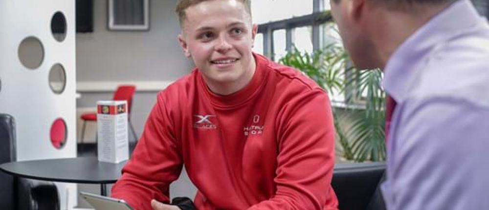 Sport-Student-In-Conversation