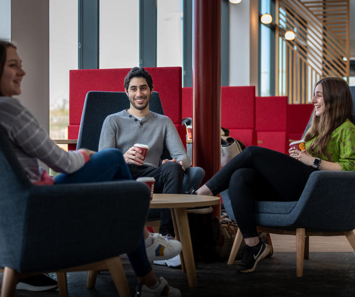 Three students drinking coffee in Graze